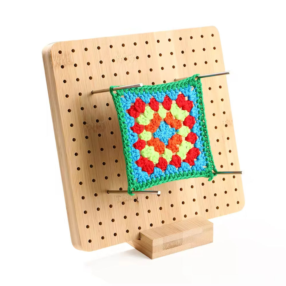 Crochet project arranged on a wooden blocking board